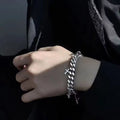 Men's titanium steel bracelet with a geometric cross charm on an adjustable strap.