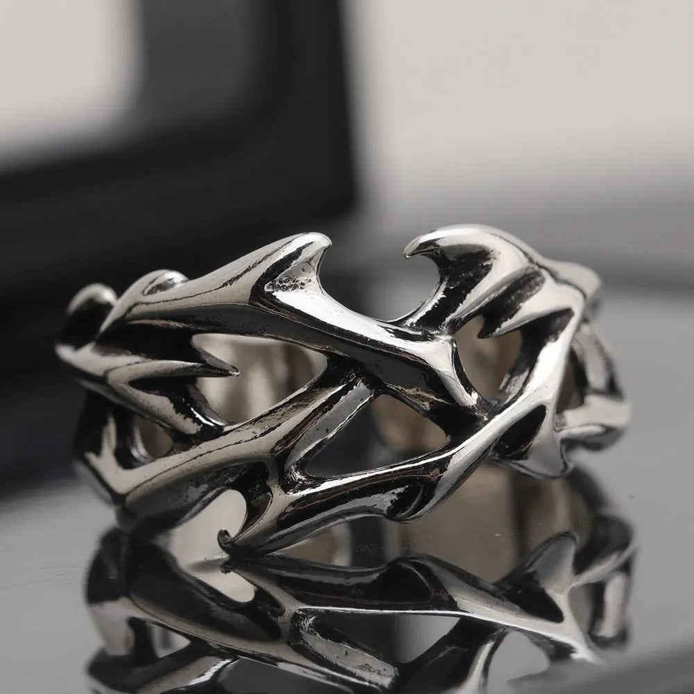 Adjustable copper men's ring with geometric thorn and flower design in J2150 colour.