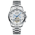 Silver men's automatic perpetual calendar mechanical watch with stainless steel strap on a wrist.