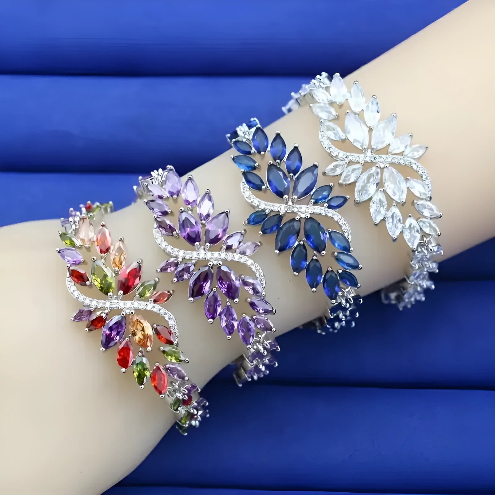 Copper bracelet with gold electroplating and coloured zircon stones in ice flower pattern design