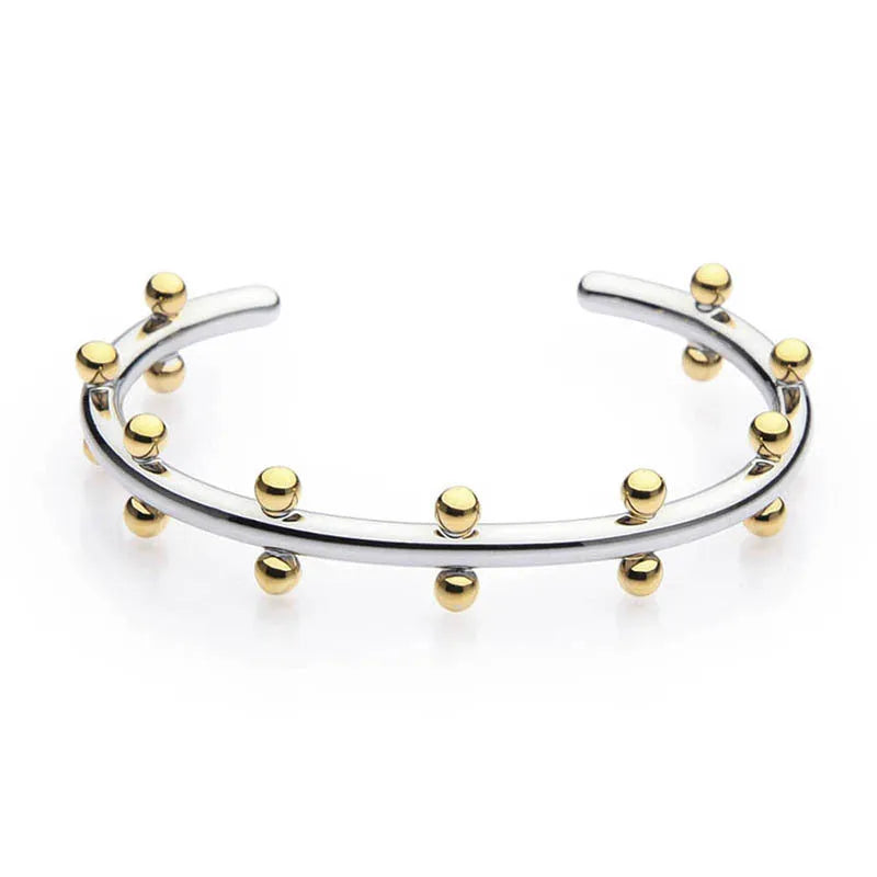C-shaped stainless steel bracelet charm with textured surface and rivet bean beads in metallic finishes