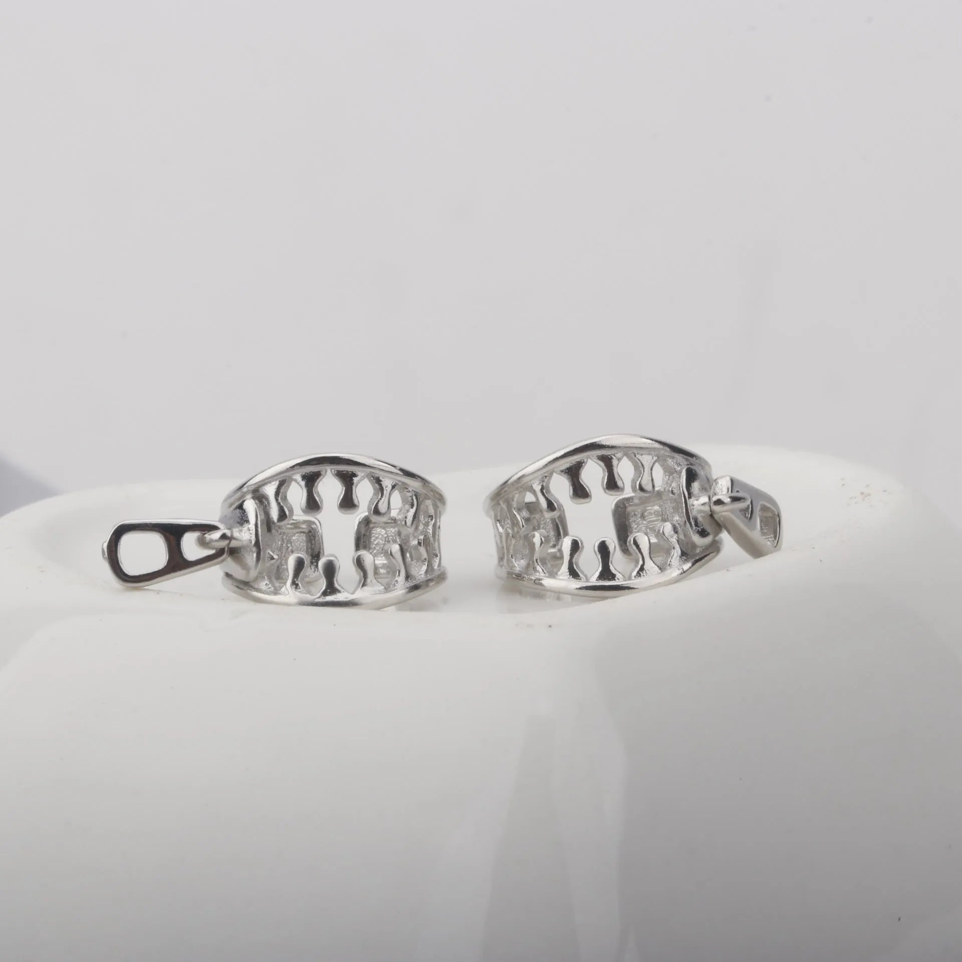Copper geometric earrings with zipper clip fastening in ES862 colour showing line detail design