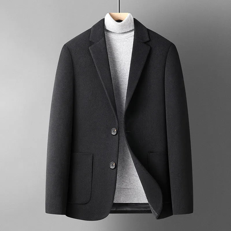 Men's slim fit wool suit jacket in grey, shown on a model, suitable for autumn and winter.