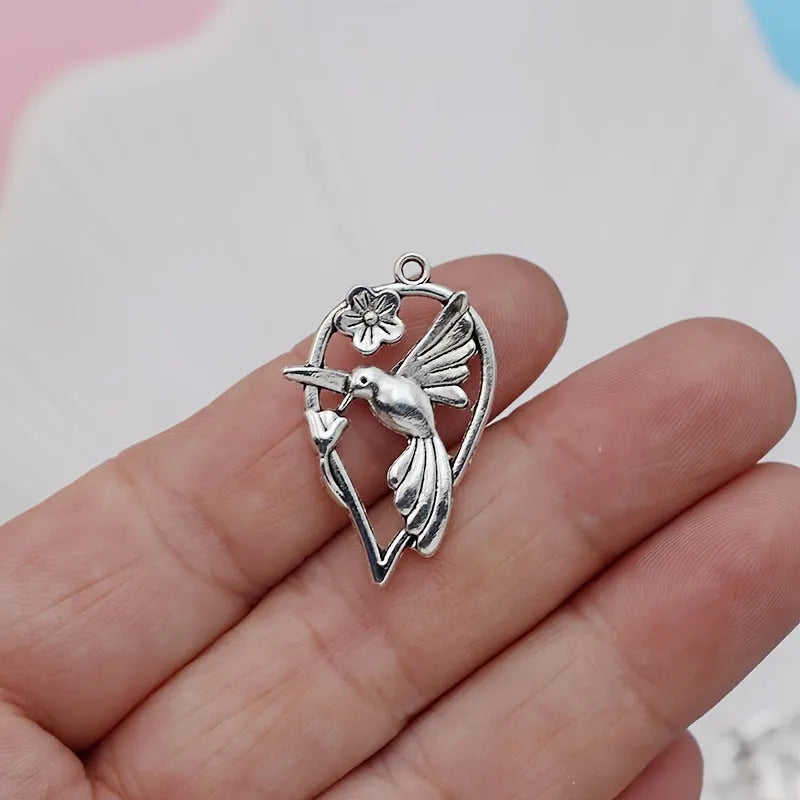Alloy flying magpie bird pendant with electroplated finish in colour P234 for DIY jewellery.