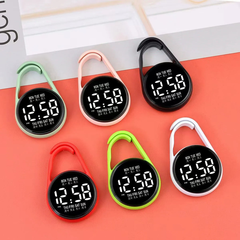 LED digital watch with luminous display showing time and weekday, available in multiple colours
