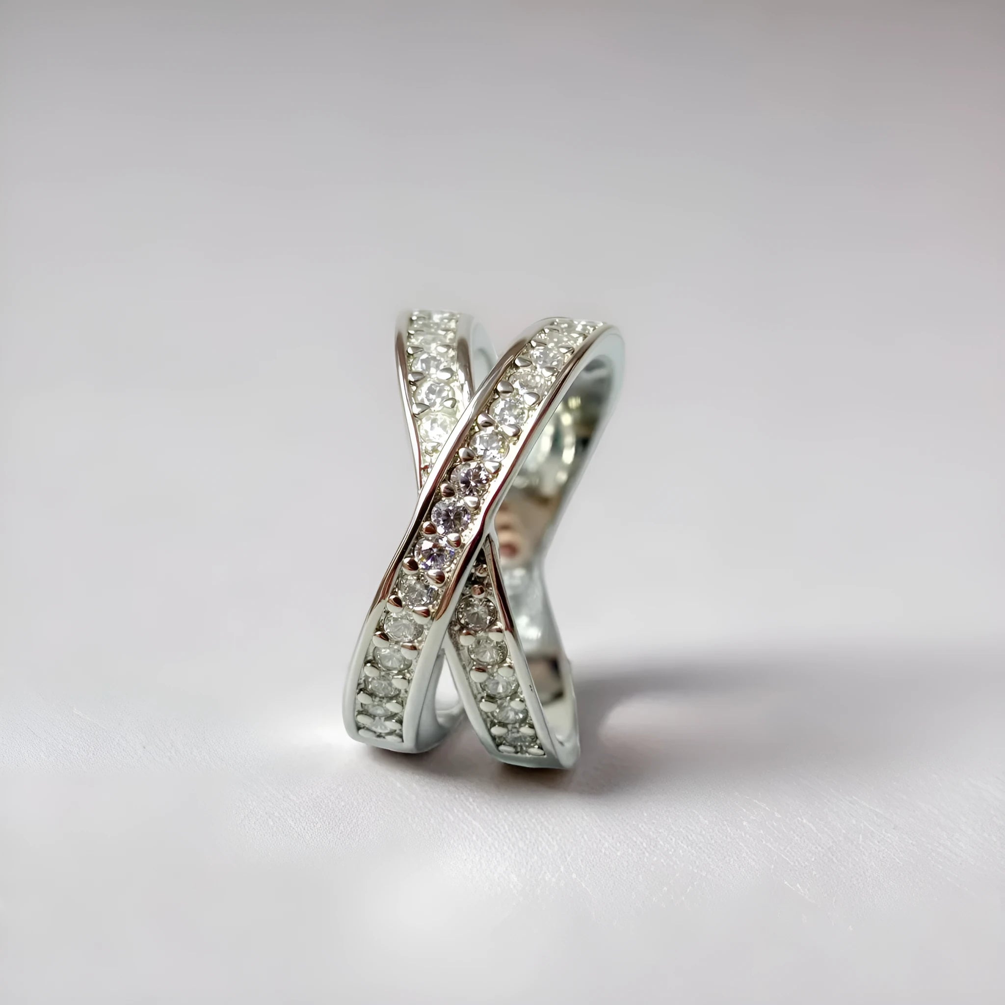Copper cross ring with micro-inlaid zircon stones in geometric heart design, available in silver or rose gold finishes
