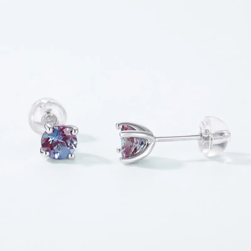 A pair of women's geometric ear studs in 925 silver with a cultivate Alexandrite colour.