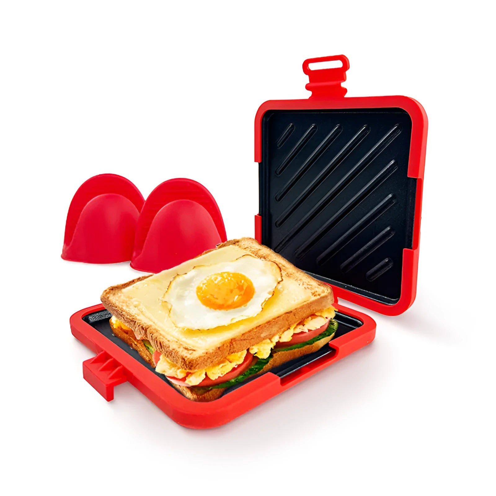 Red silicone baking tray with a pair of matching oven gloves on a kitchen counter