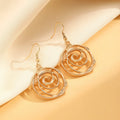 Gold spiral donut charm jewellery set showing necklace, bracelet and earrings on a white background