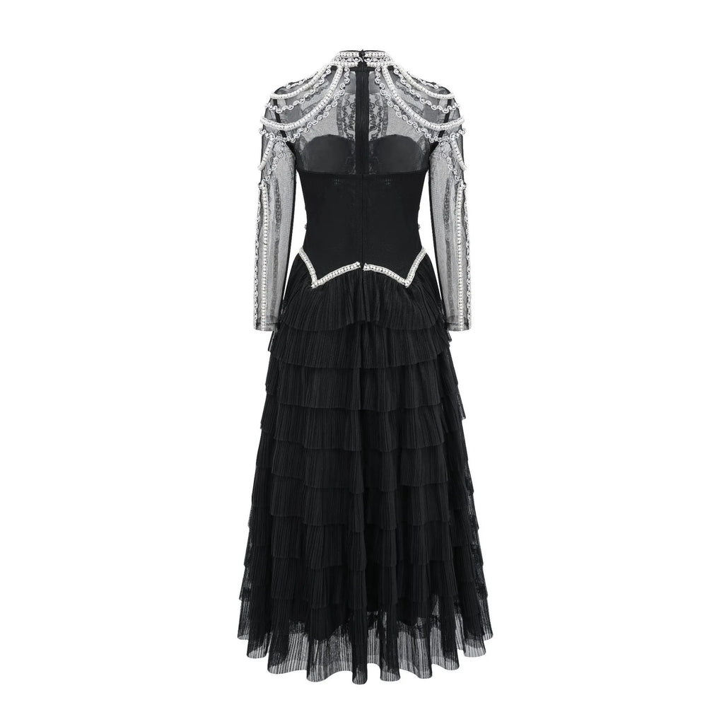 Women's black long sleeve beaded dress with a long skirt and mid waist, also available in pink.
