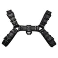 Black leather chest bondage strap with metal buckle and rivet detail on a mannequin