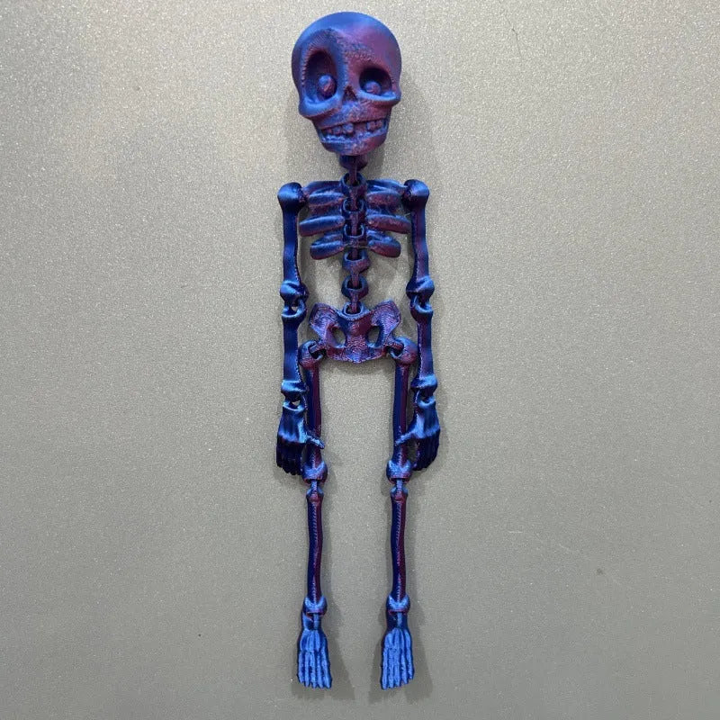 Tall 3D printed white skull ornament with intricate detail placed on a refrigerator door.