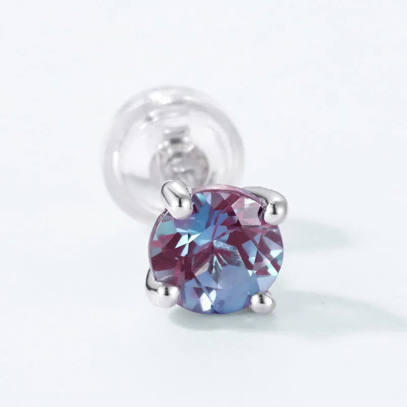 A pair of women's geometric ear studs in 925 silver with a cultivate Alexandrite colour.