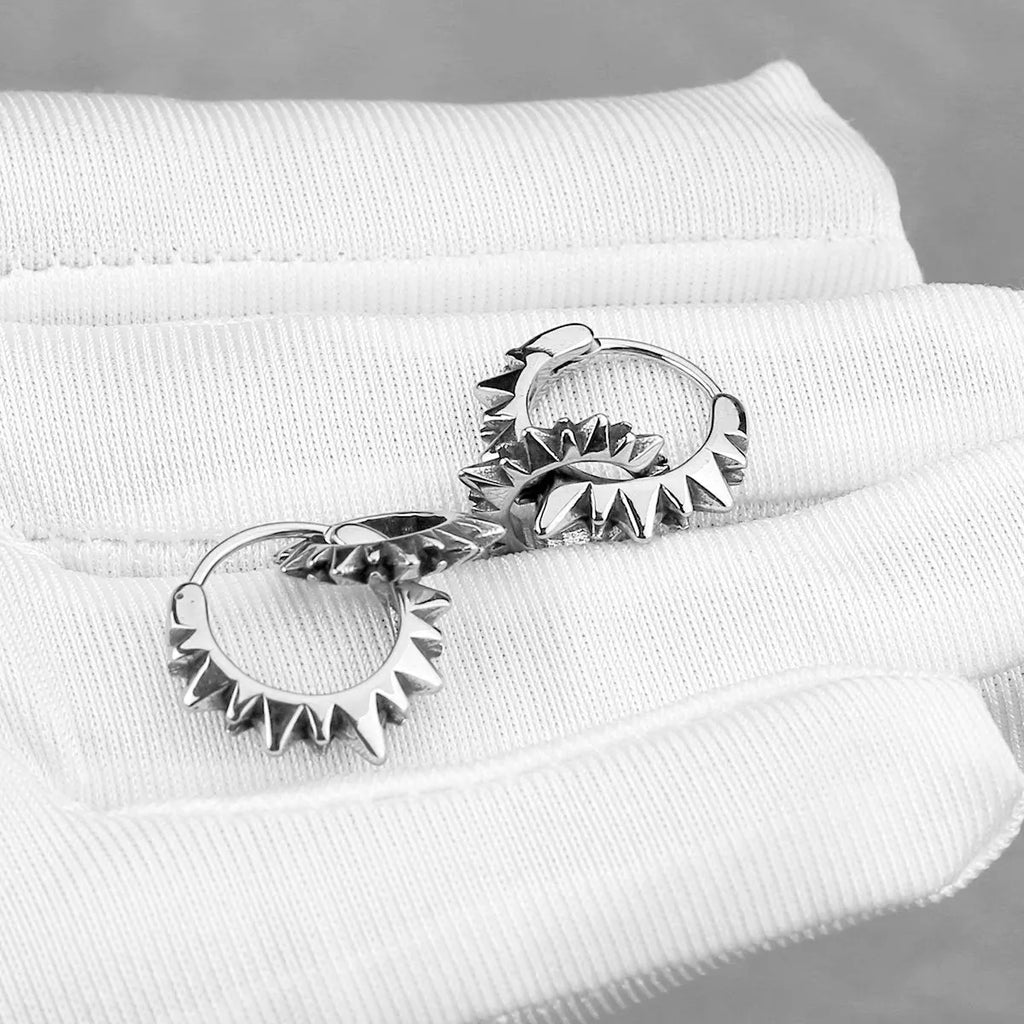 Polished stainless steel round ring earrings with retro circular design in steel colour