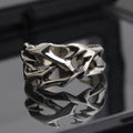 Adjustable copper men's ring with geometric thorn and flower design in J2150 colour.