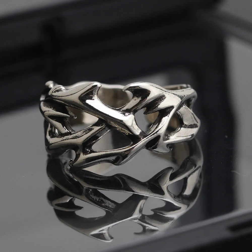 Adjustable copper men's ring with geometric thorn and flower design in J2150 colour.