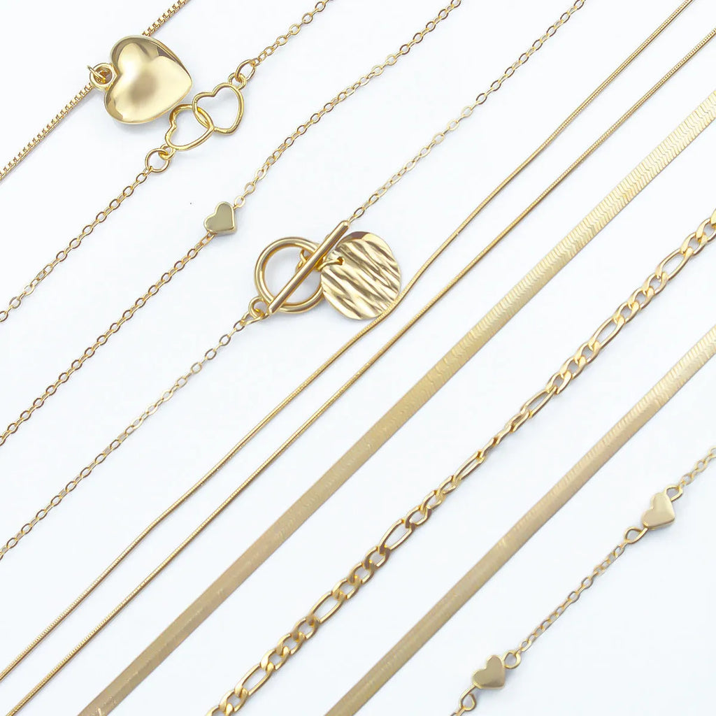 10-piece women's gold necklace set with snake bone chain and alloy pendants