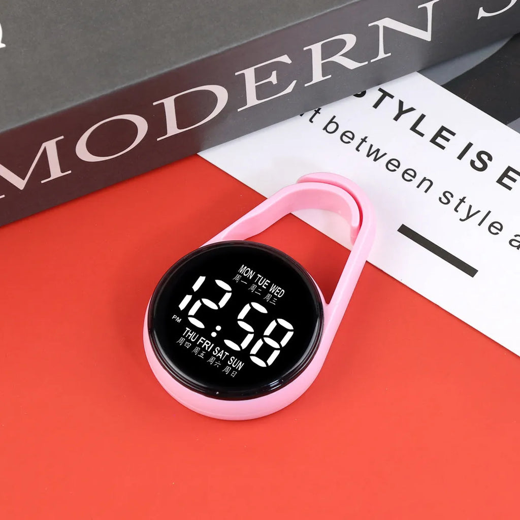 LED digital watch with luminous display showing time and weekday, available in multiple colours