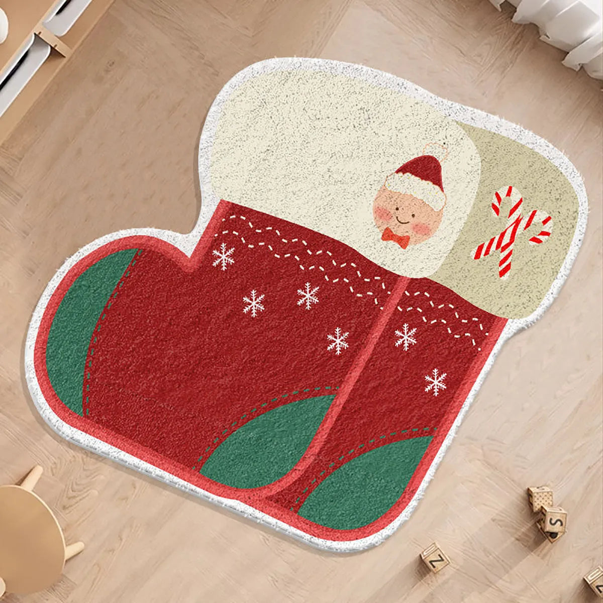 Round alien-shaped Christmas floor mat in imitation cashmere with festive gingerbread man design.