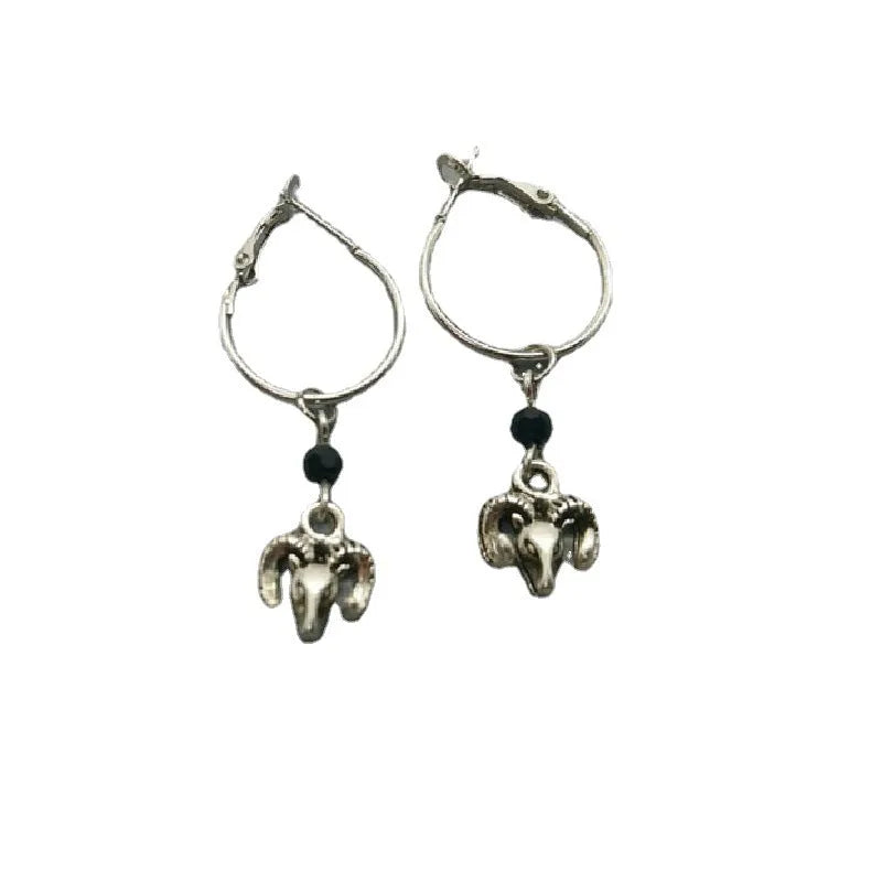 A pair of silver-coloured alloy round ring earrings for women with a Tibetan antelope design influence.