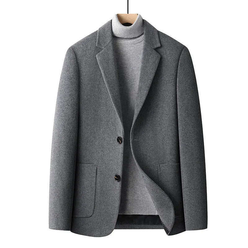Men's slim fit wool suit jacket in grey, shown on a model, suitable for autumn and winter.