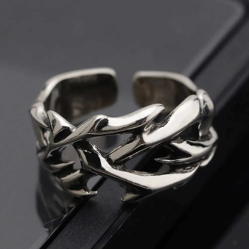 Adjustable copper men's ring with geometric thorn and flower design in J2150 colour.