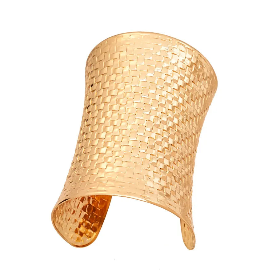 Women's vintage exaggerated metal bracelet in gold or silver colour with round design elements.