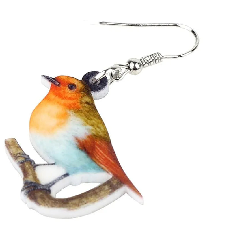Acrylic geometric pendant earrings with a printed blue titmouse and snake chain design.