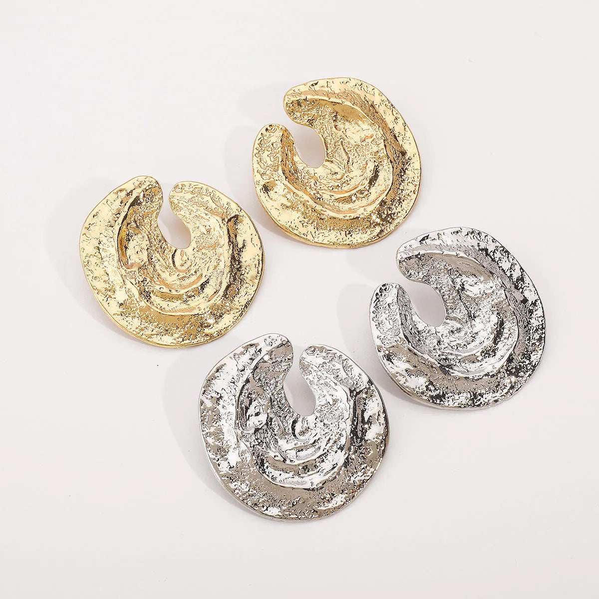 Geometric women's earrings with exaggerated irregular pleated design and concave-convex texture in gold finish