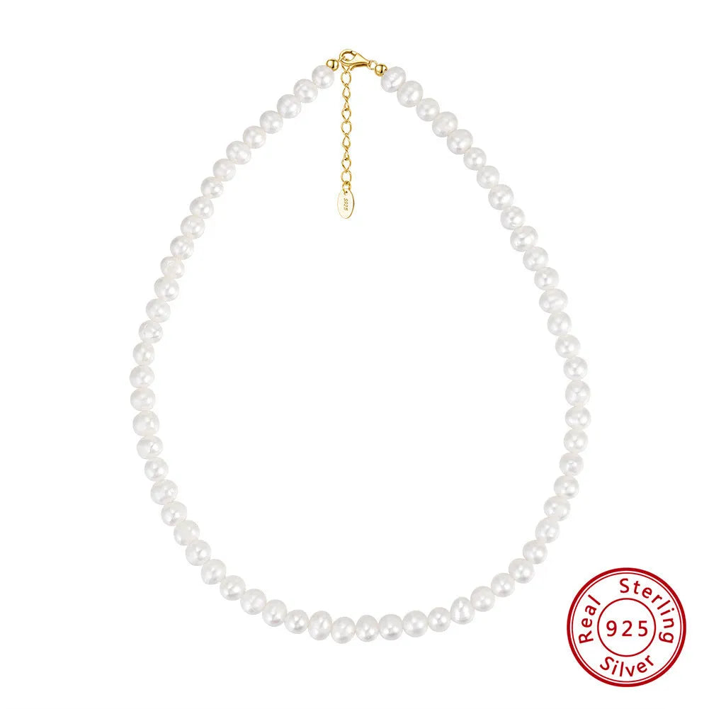 Women's adjustable silver necklace with a strand of natural freshwater pearls.