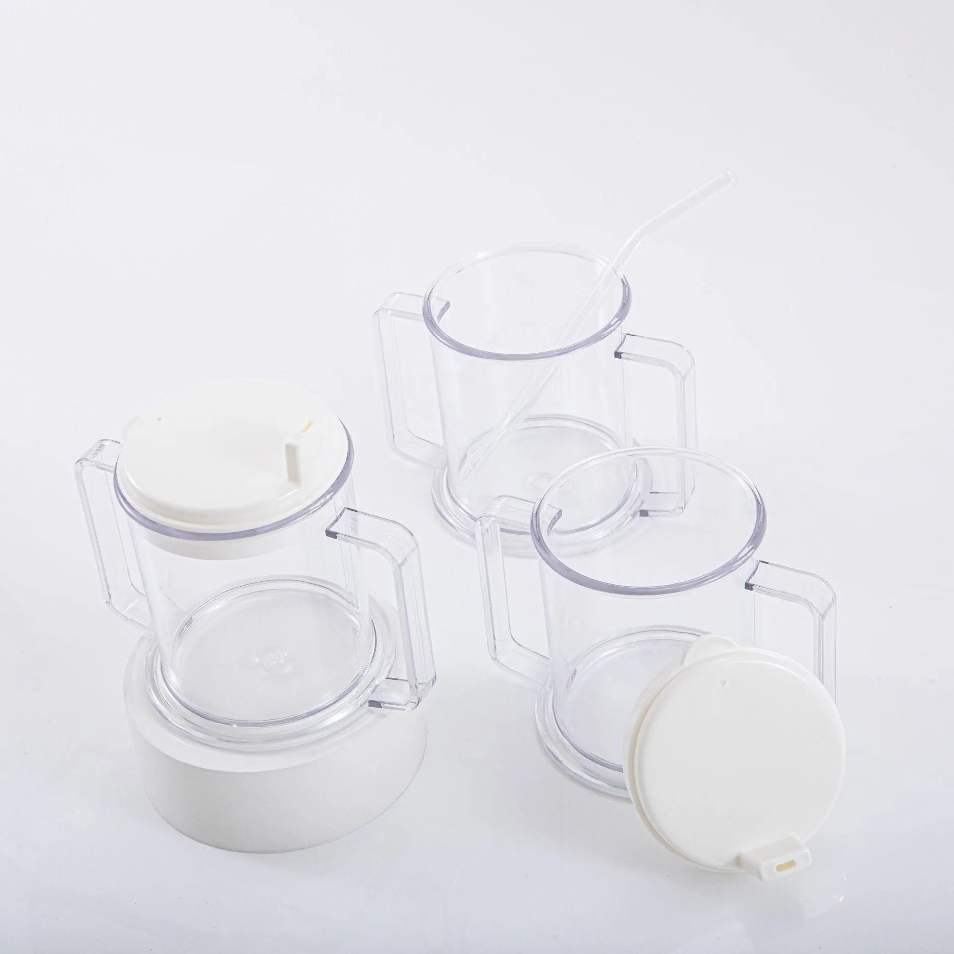 Transparent spill-proof drinking cup with lid showing 14cm height