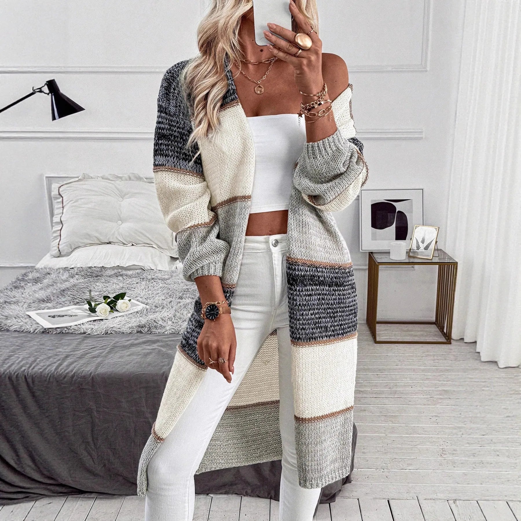 Grey striped women's long cardigan with loose fit and knitted construction