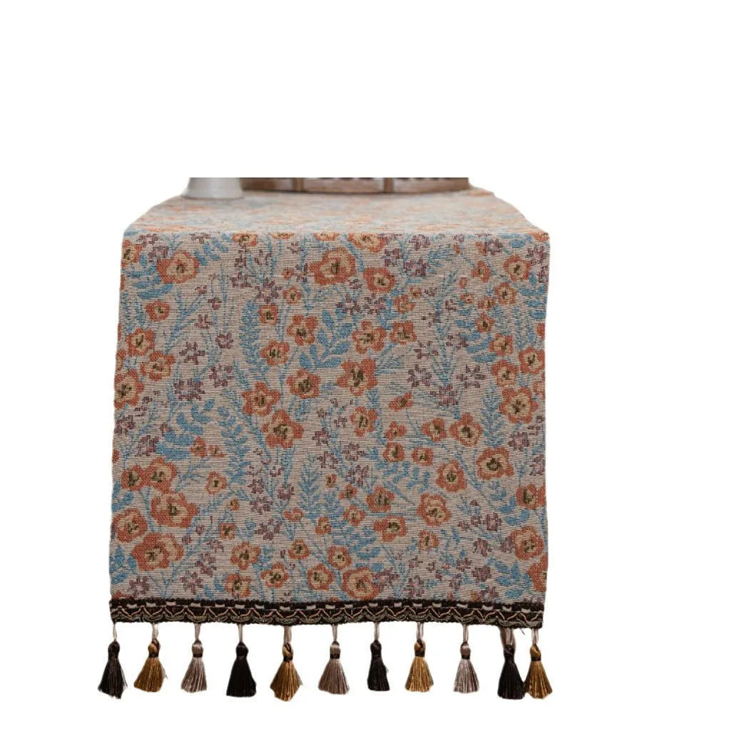American-style long tassel table runner with Jacquard floral pattern on a table