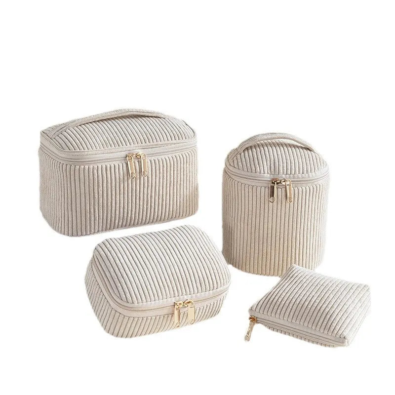 Four cube-style flannelette makeup bags in a set, shown in blue with dots colour.