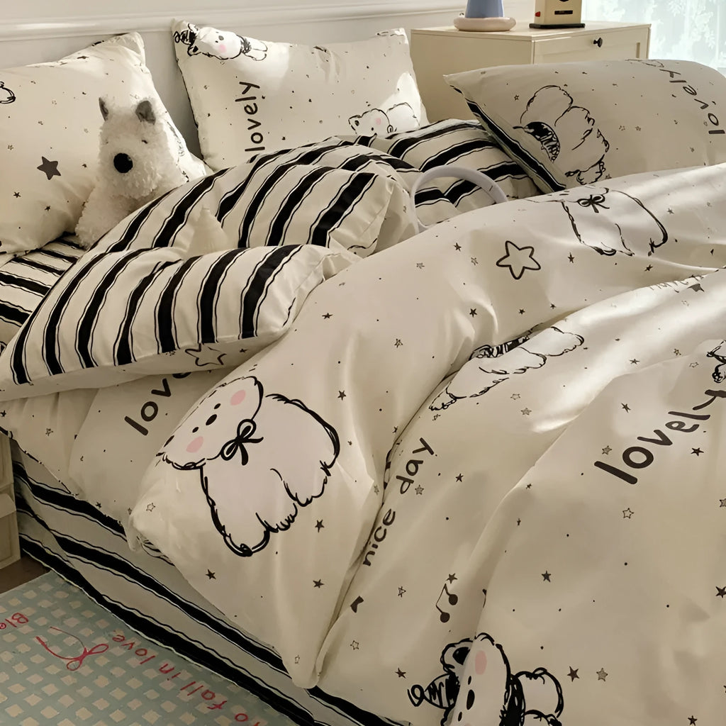 Cartoon dog print pure cotton four-piece duvet cover and bed sheet set on a bed.