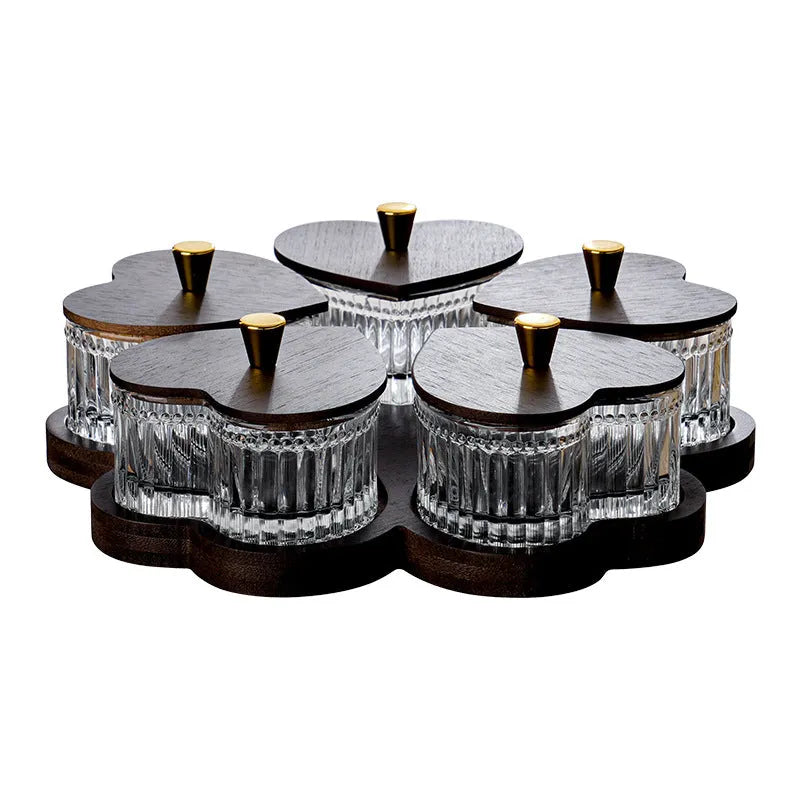 Glass serving platter with coloured glaze and multiple compartments, each with a transparent heart-shaped lid.
