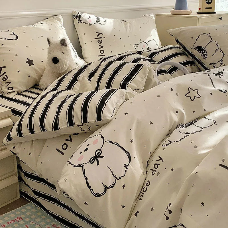 Cartoon dog print pure cotton four-piece duvet cover and bed sheet set on a bed.