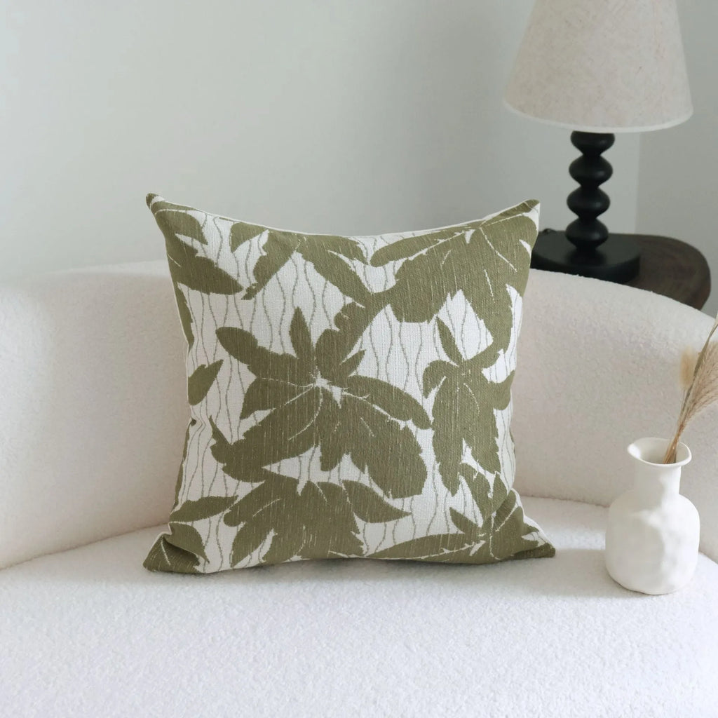 Green decorative hotel pillow set with striped and leafy patterns, shown with a matching pillow core.