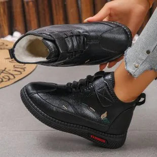 Women's black velvet house shoes with non-slip rubber sole and hollow-out decorative elements