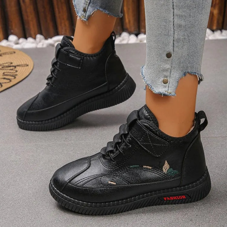 Women's black velvet house shoes with non-slip rubber sole and hollow-out decorative elements