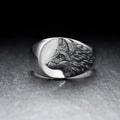 Men's silver geometric wolf head signet ring on a black background, showing its retro-inspired alloy design.