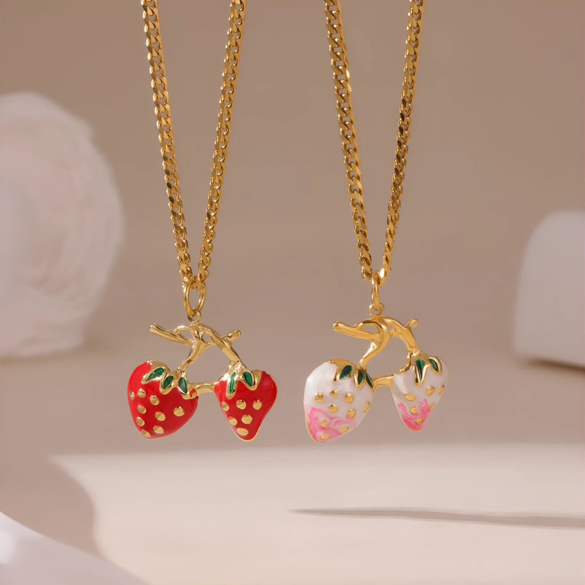 Stainless steel necklace with a strawberry fruit pendant in red or white gradient colour.