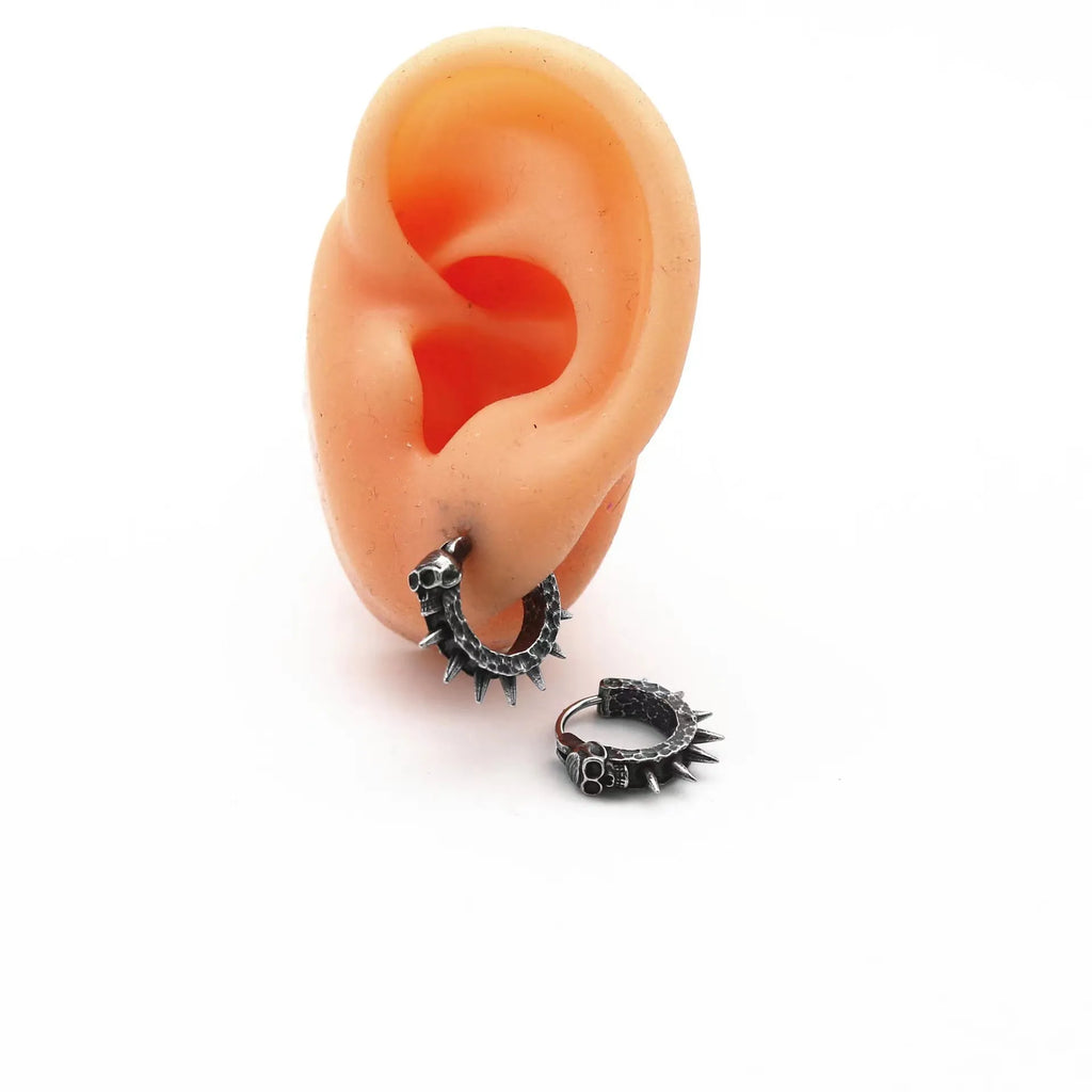 Black geometric alloy earrings with a punk motorcycle theme on a white background