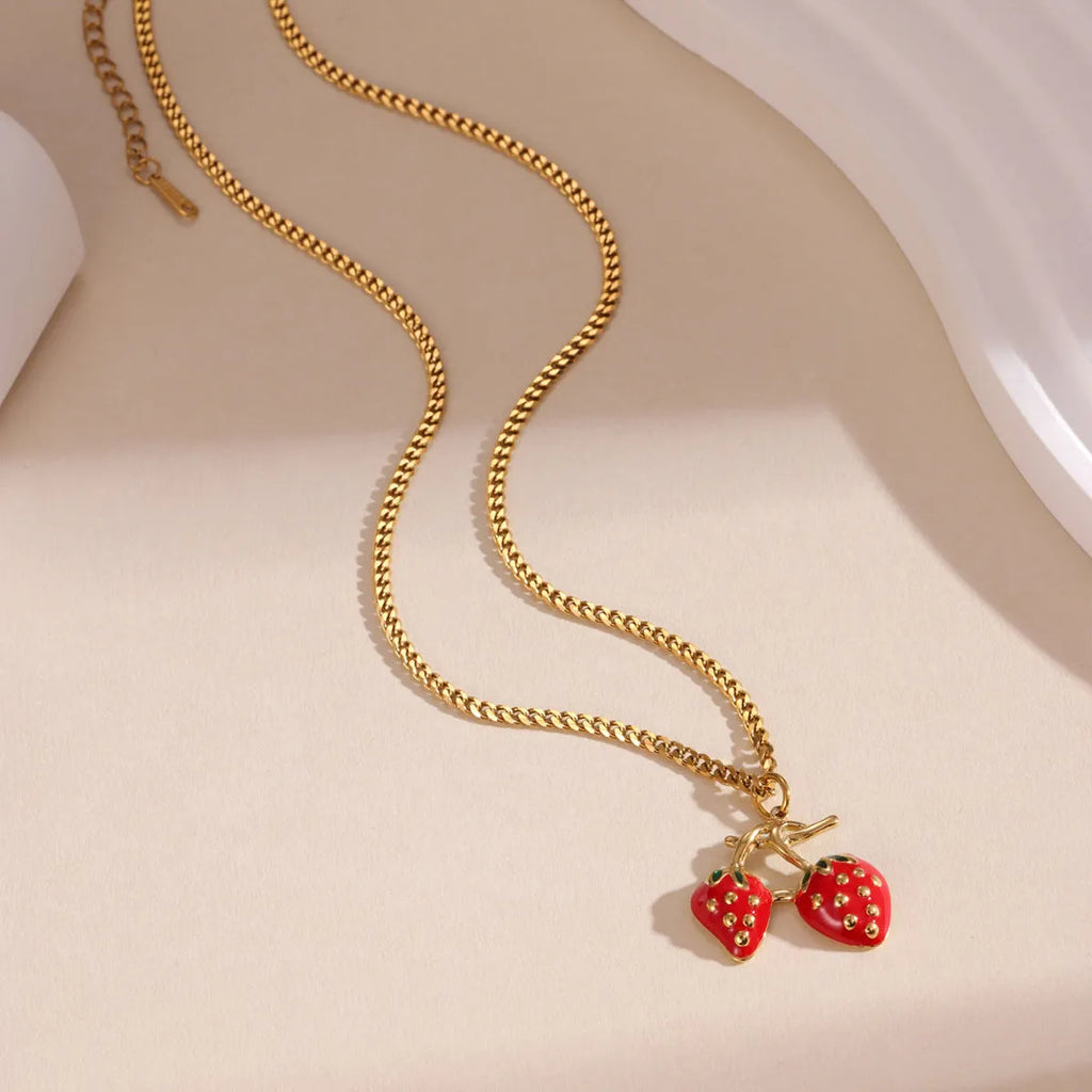 Stainless steel necklace with a strawberry fruit pendant in red or white gradient colour.