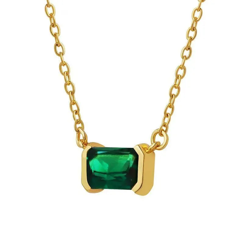 Gold-coloured geometric quadrilateral pendant necklace on a model, showing Lvzuan inlay detail on copper.