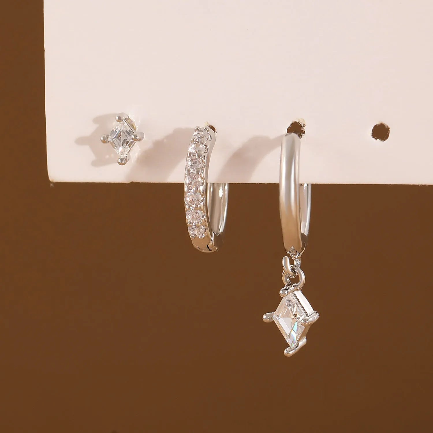 Ladies three-piece zircon geometric earring set in gold and silver finishes