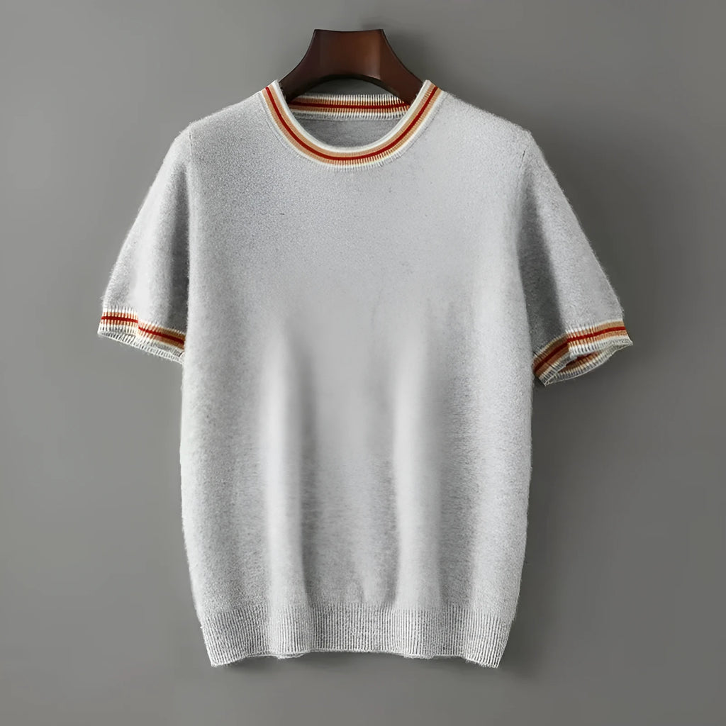 Men's short sleeve pure wool sweater in round neck pullover style on a grey background.