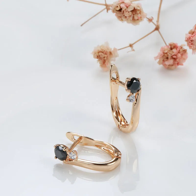 Gold drop earrings with geometric design and black agate stone inlay on copper base