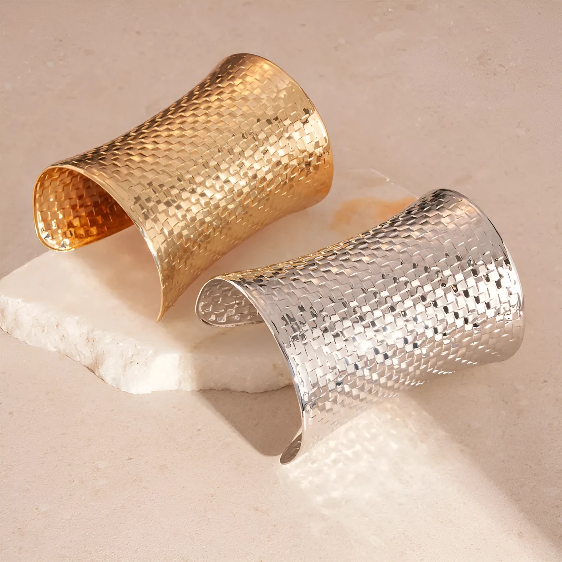 Women's vintage exaggerated metal bracelet in gold or silver colour with round design elements.