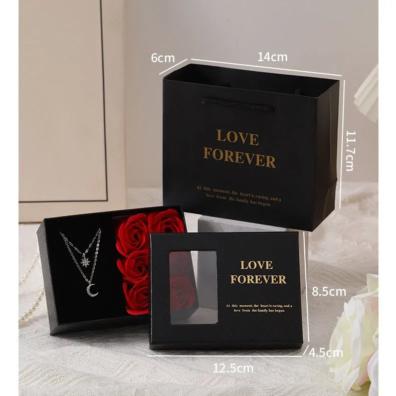 Korean style soap flower gift set with six red roses in a jewellery box, includes a handbag.